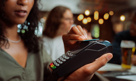 woman paying for something with her credit card