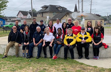 Group poses for a photo in a park in Hoquiam