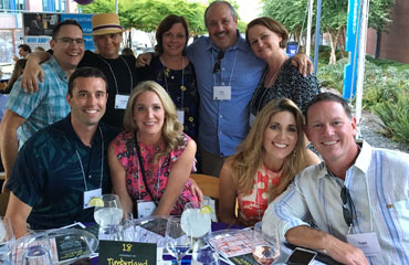 Timberland employees pose for a photo at their table at the University of Washington Summer Soiree