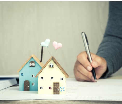 signing papers for a house