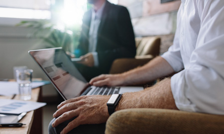 Man in a meeting on a laptop