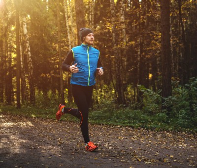 Man running on a trail. 