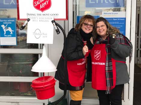 Wendy and Carol volunteer as bell ringers for the Salvation Army