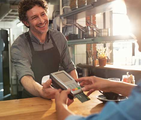 customer pays for coffee using a debit card