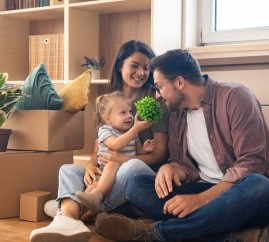Couple with child moving into new home