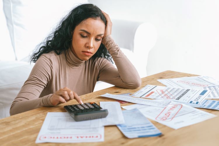 Stressed out woman doing her taxes.