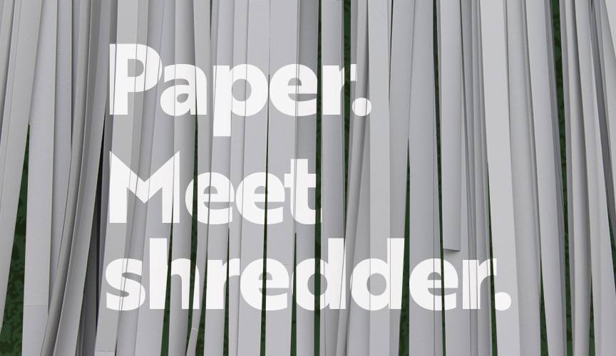 Photo of paper being shredded with the title, "Paper. Meet shredder". 