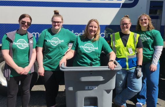 Smiling volunteers at a Timberland Bank Shred Day in West Olympia.