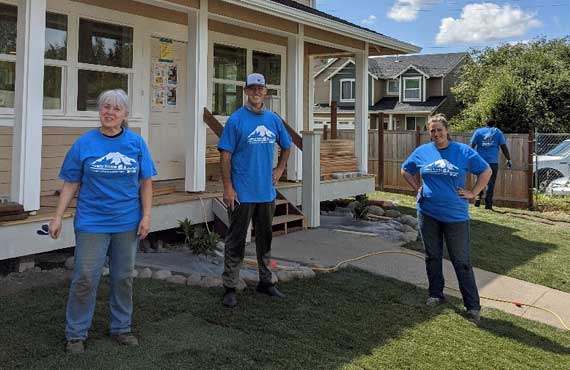Timberland Bank employees, Kitty, Todd and Emily, volunteer at Pierce County Habitat for Humanity's Build Day