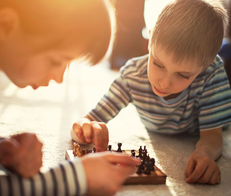 Brother and sister playing chess