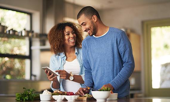 couple smiling over phone