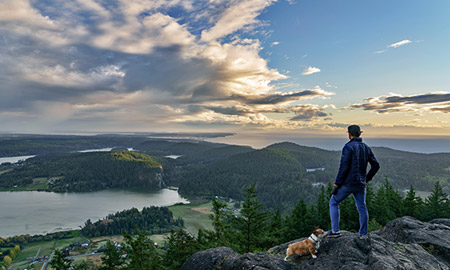 man hiking with dog