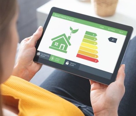Woman on tablet looking at smart home energy
