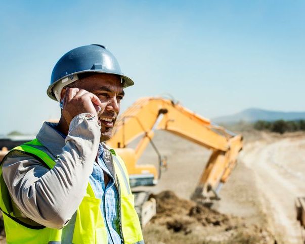 Man on phone at construction site