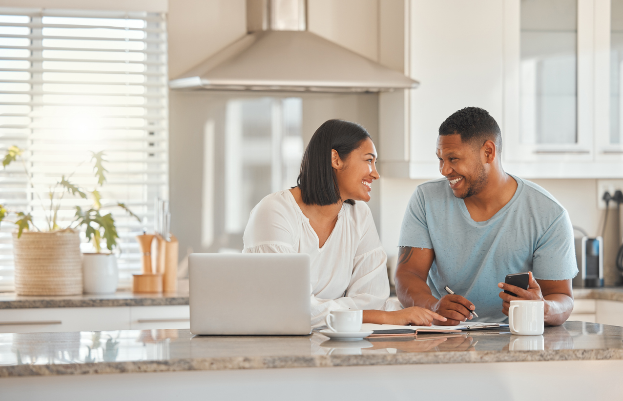Couple in kitchen talking