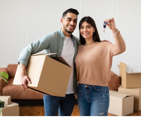 man and woman moving into house