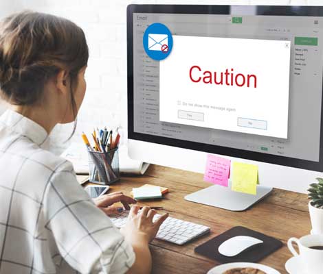 "caution" pop up appears on computer while employee is accessing email