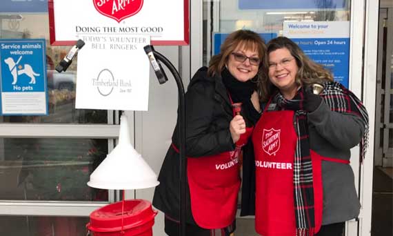 Wendy and Carol volunteer as bell ringers for the Salvation Army