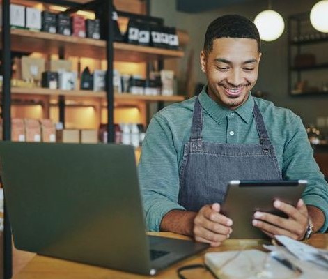 small business owner on tablet in store