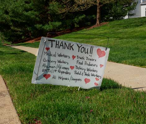 homemade yard sign reading "thank you" to essential workers